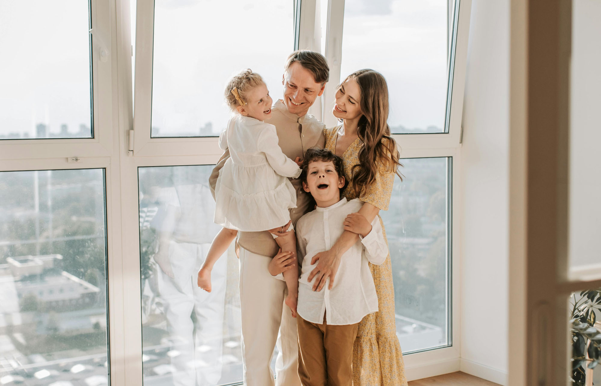 A family stood in their new home.