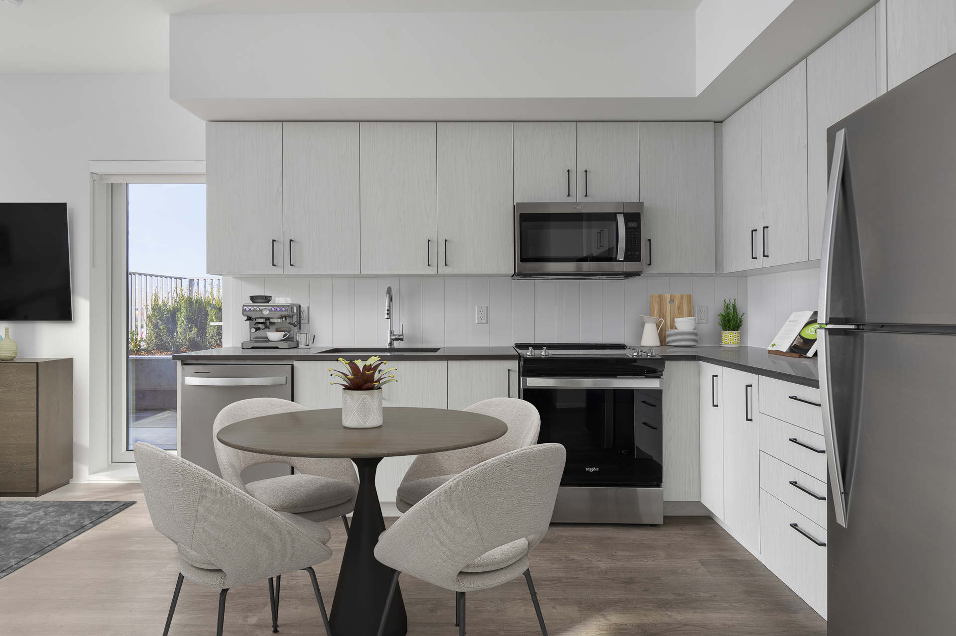 Interior kitchen and living space of a newly built apartment building.